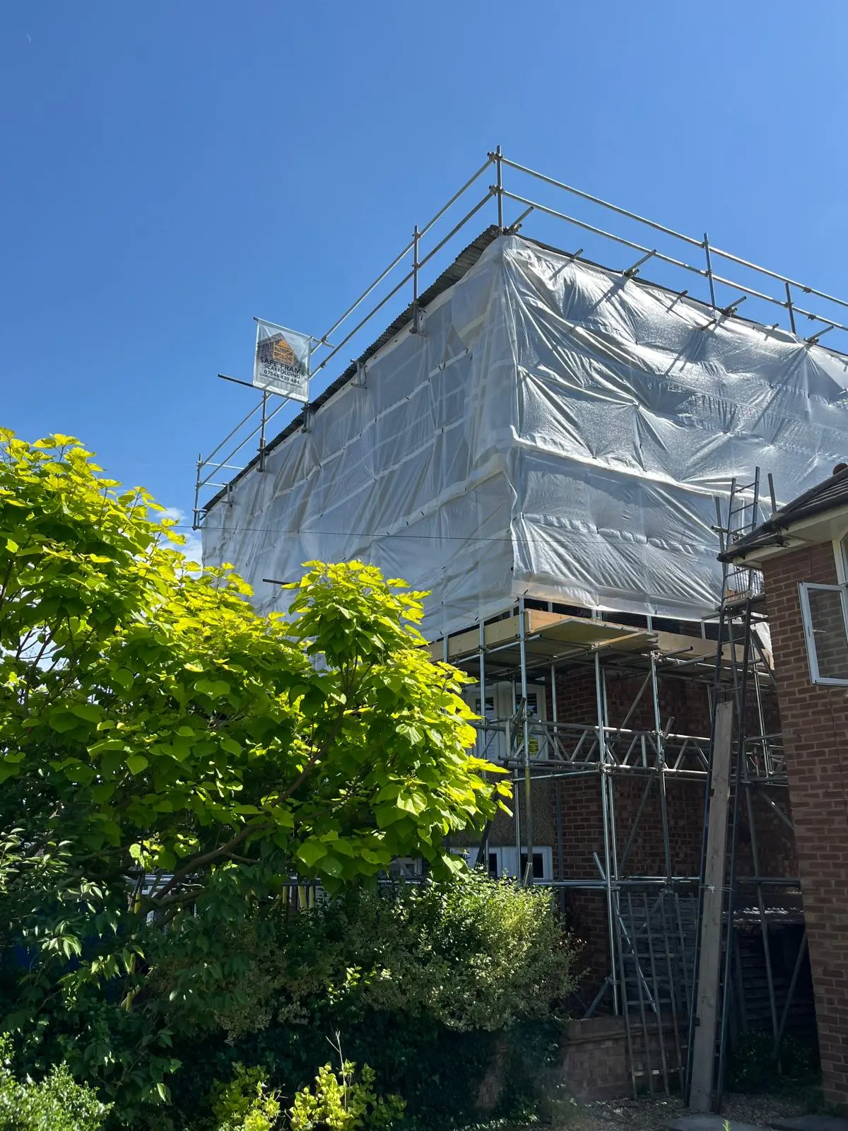 Wrapped scaffolding around a residential building