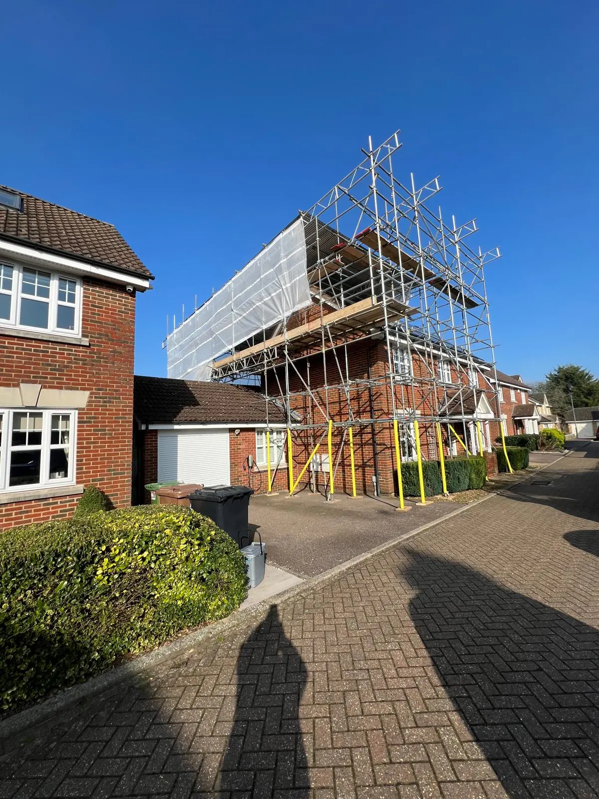 Scaffolding around the side of a home